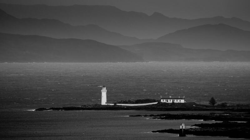 Isle Ornsay lighthouse on the Isle of Skye emerges from a winter thunderstorm