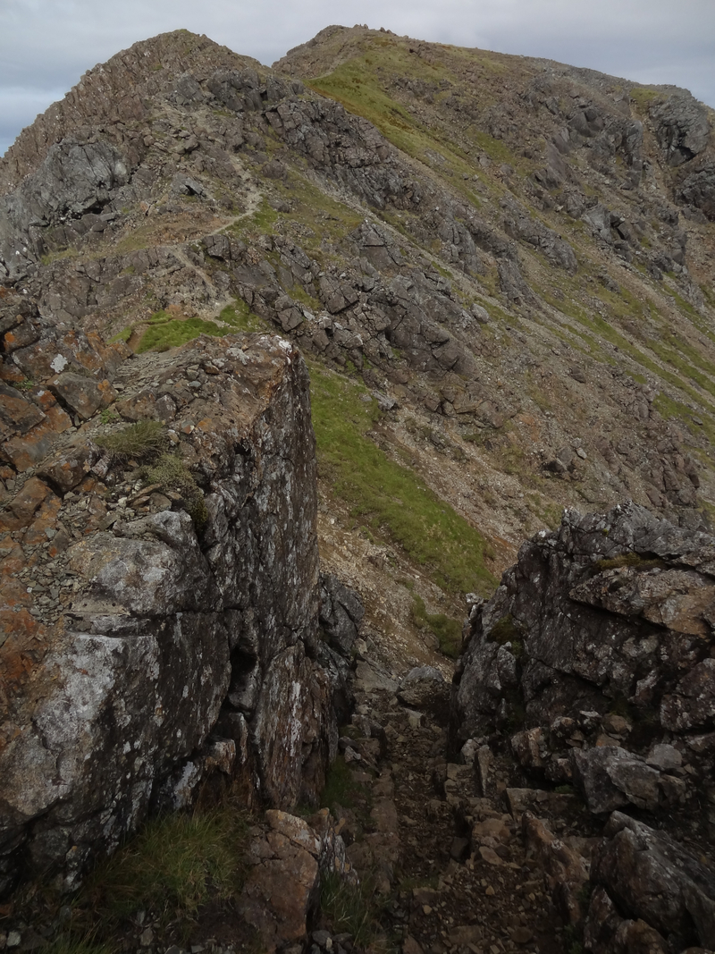Looking down the chimney on the south summit to the main summit of Blaven